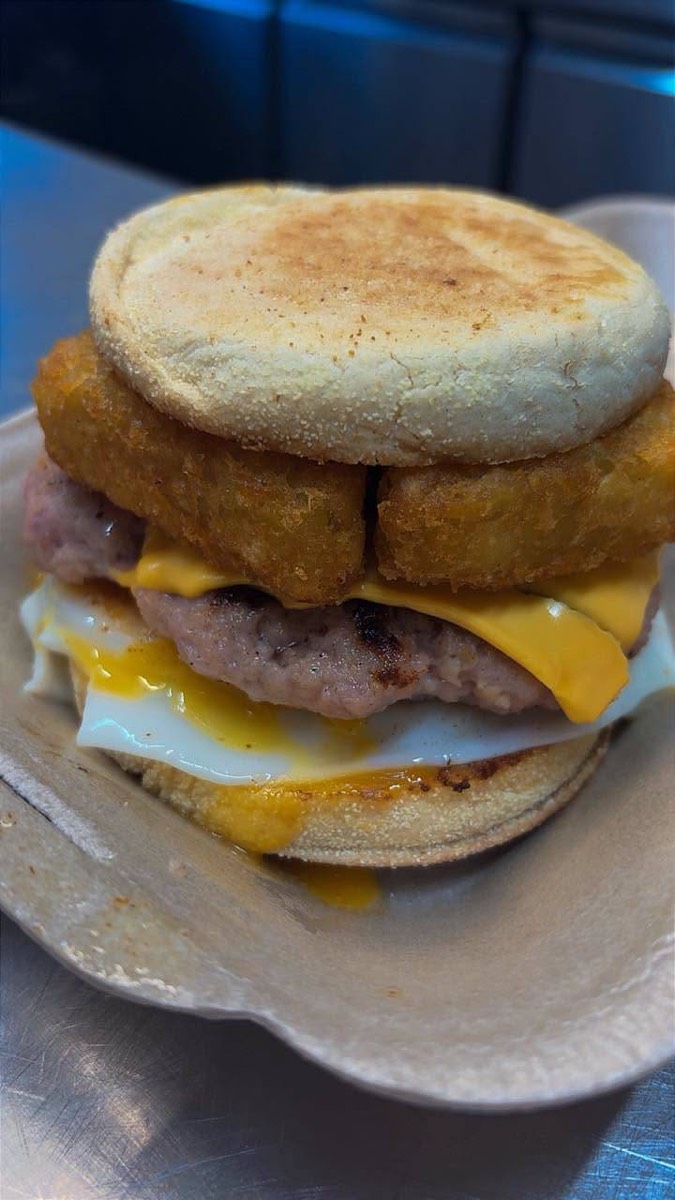 Breakfast muffin with sausage, hash brown, egg and cheese